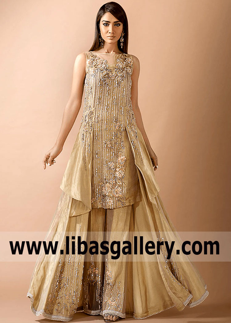 A new exhibition, Royal Style in the Latest Pakistani Fashion Trends Long Butterfly style Shirts and Trousers in Floor Length New York City NY. The lavish dress Created by Alishba and Nabeel known for its intricate details Stunning embellishments.