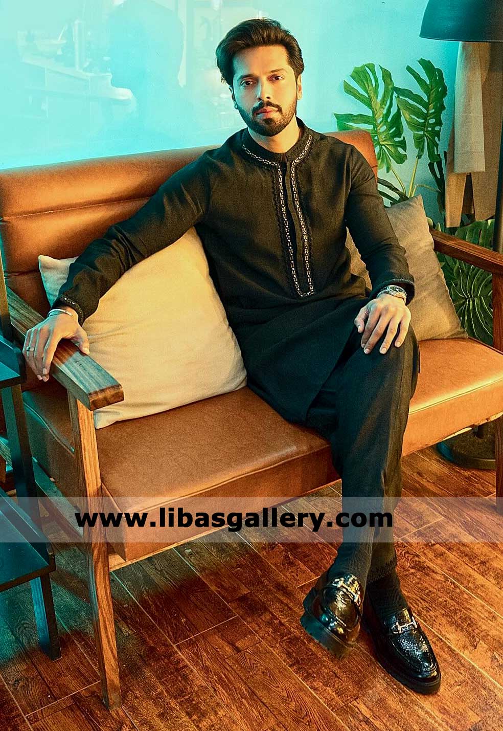 Black kurta with embroidery design on placket cuff and neck for men occasion paired with black trouser fahad mustafa wearing UK USA Canada Dubai