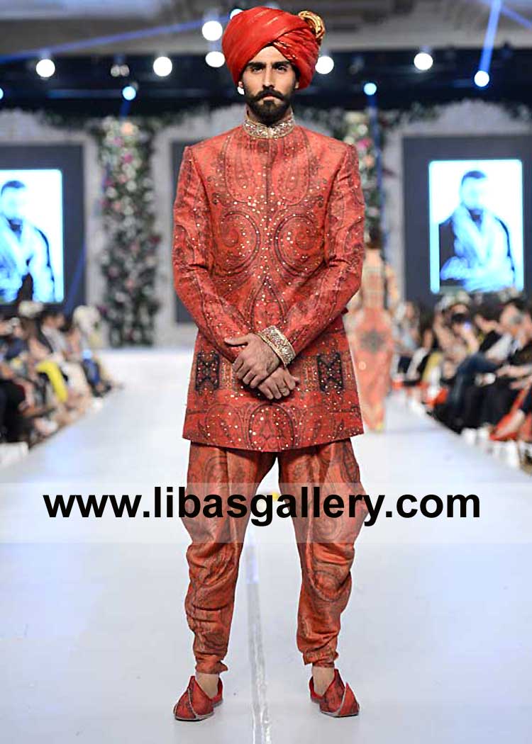 Hasnain Lehri standing on Ramp Wearing Red Turban for Nikah Event with Short tail and long tail of Groom Choice 