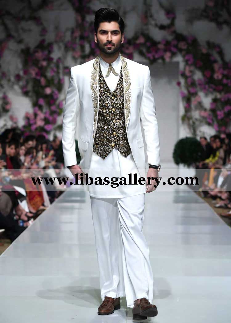 white groom prince coat with embroidered lapel and inner sleeveless vest paired with flared bell bottom type pajama saudi arabia qatar usa
