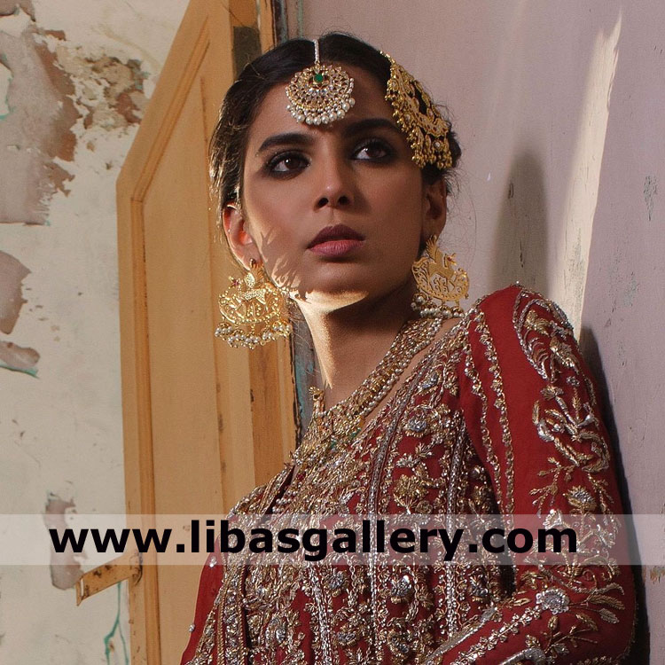 Stunning bride looking at groom in gold plated bridal jewellery