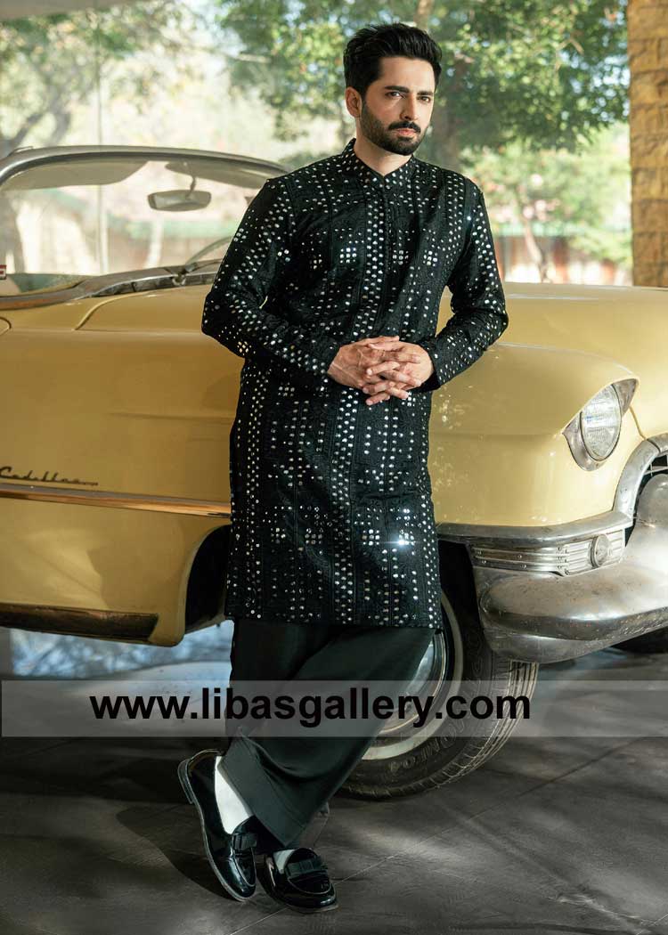 Black embroidered Men kurta shalwar set featuring embellished embroidery patterns with a pleated band collar and button-down closures New York Chicago USA
