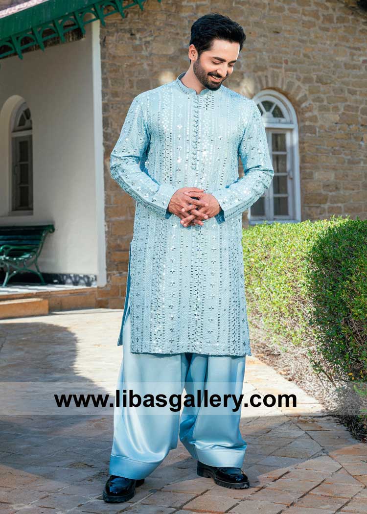 Polar ice blue embroidered kurta and shalwar featuring embellished embroidery detailed with a pleated band collar and loop button Doha Jeddah Dubai Oman Bahrain