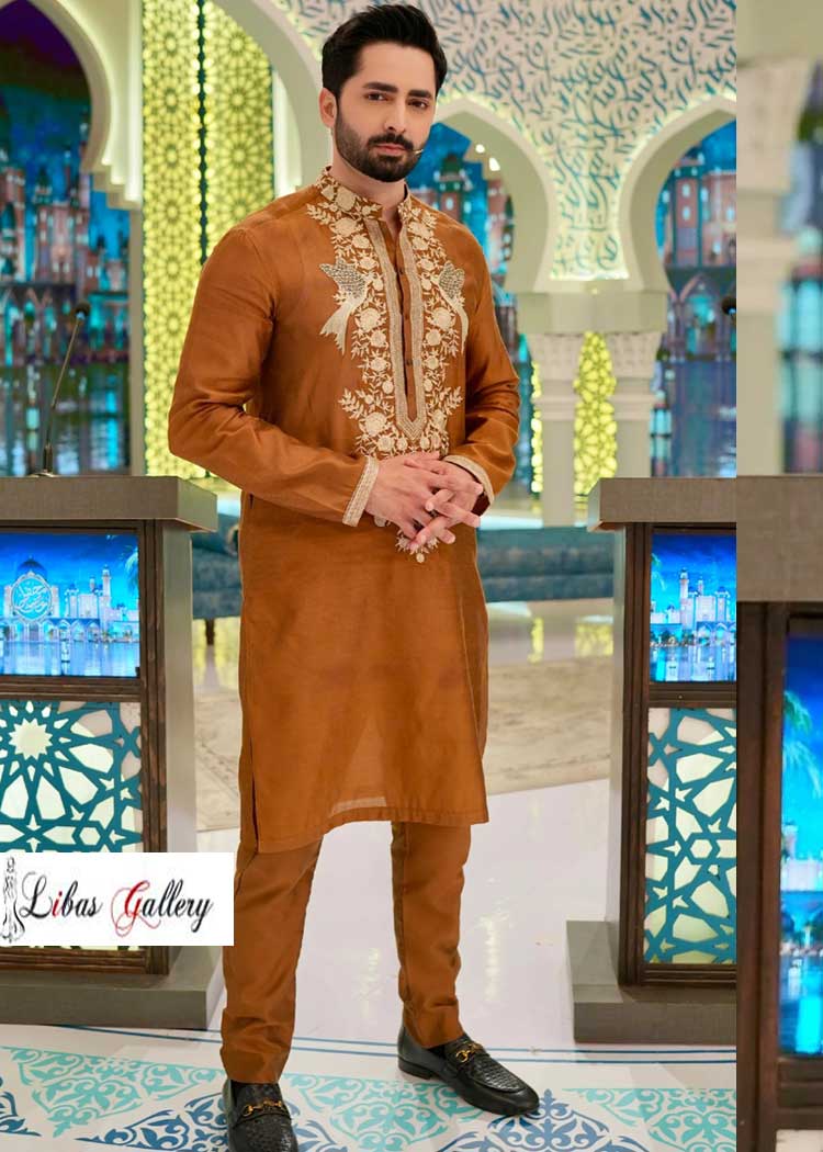 This Light Brown Men Embroidered Kurta Pajama suit speaks louder than words