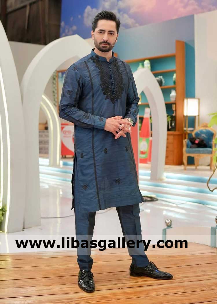 Blue occasion kurta for men adorned with black embroidery on neck sleeves and collar with thread nicely paired with trouser 