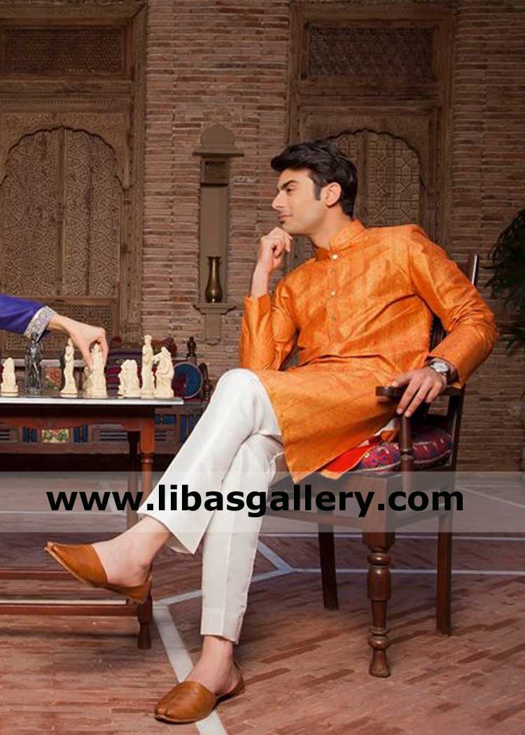 Fawad khan sitting in Men Celebrity Style beautiful orange kurta paired with off white trouser best for party dinner outdoor Belfast Derby Plymouth USA