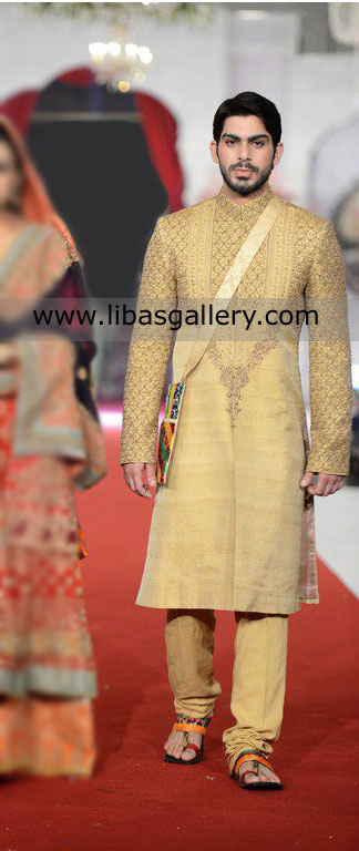 Golden sherwani embellished groom walking in sleeper and carrying bag Jeddah Riyadh Saudi Arabia
