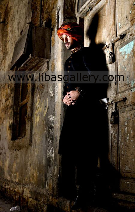 Groom Standing near locked door in black wedding sherwani