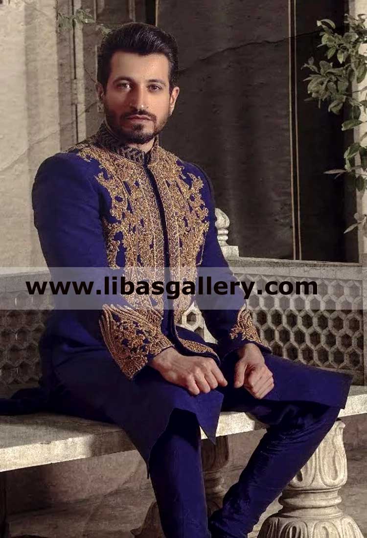 navy blue groom sherwani suit paired with pants and heavy gold hand embellished correct for nikah barat time sweden spain france