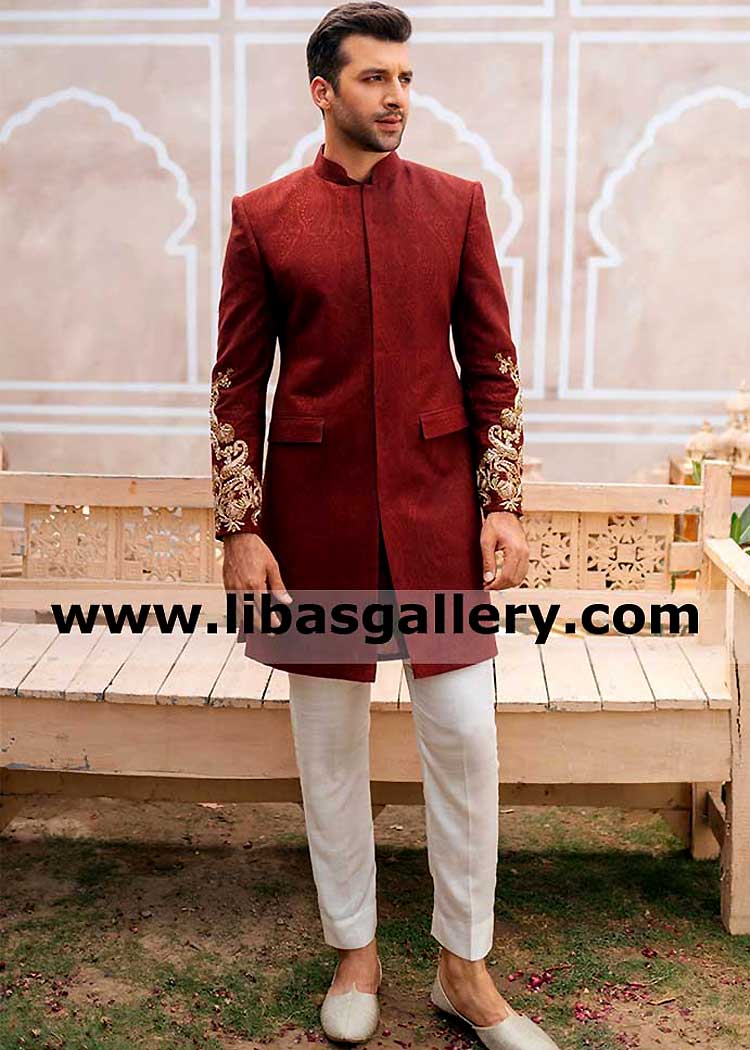 Handsome slim groom wearing burgundy barat nikah wedding jacket