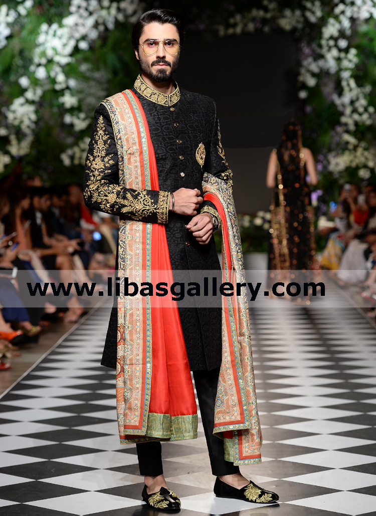 proud and happy groom celebration in black gold jamawar wedding sherwani