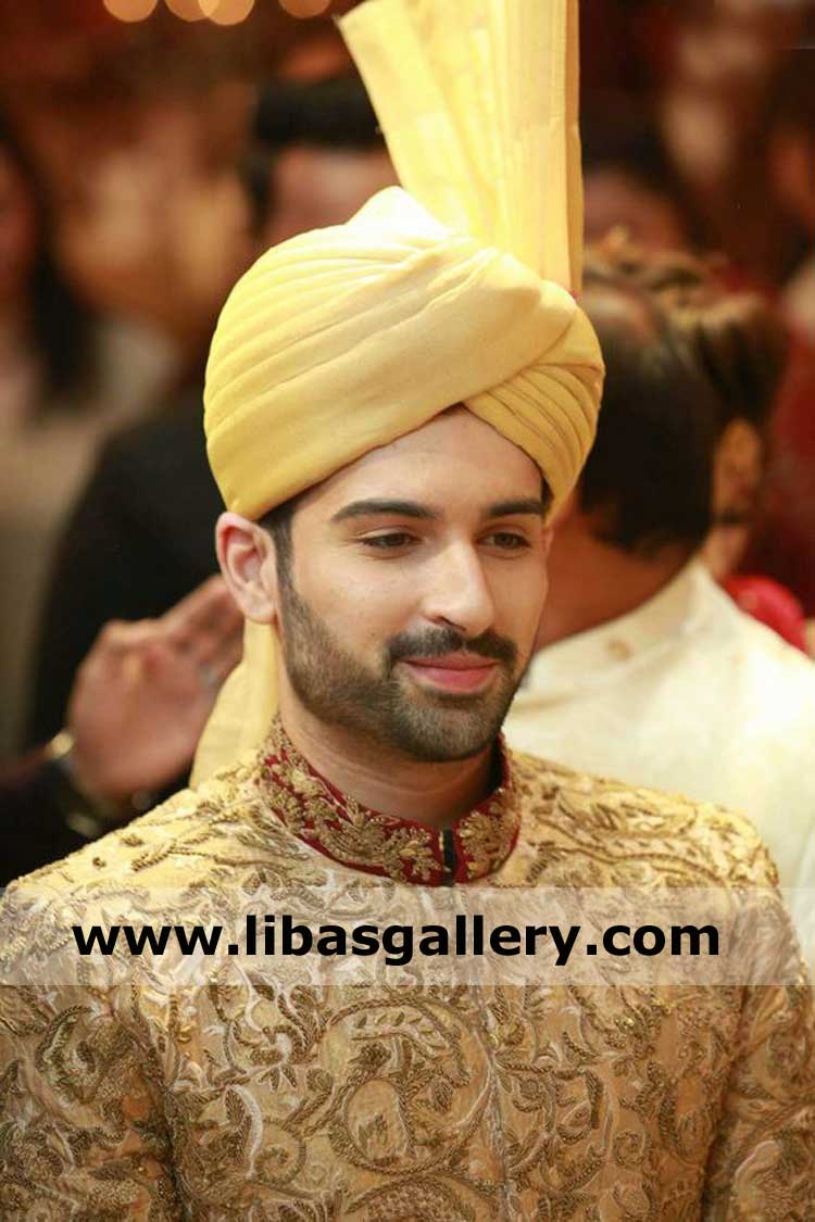 Happy groom on nikah in tower turban amber with pretty bride