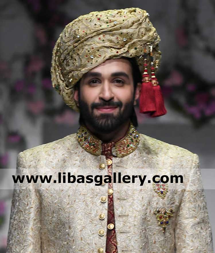 happy face groom showing embroidered wedding turban