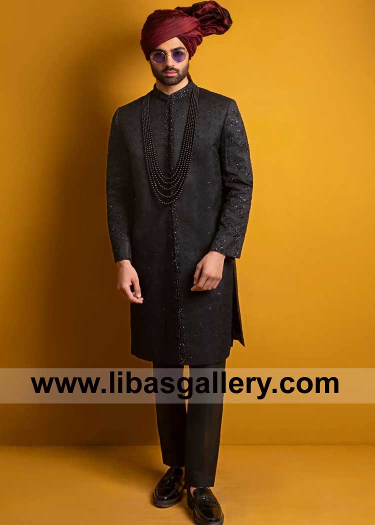 Heavy Black Sherwani Chikankari embroidery and dazzling crystal embellishments Paired with rich burgundy turban and sleek black inner UK USA Canada Australia Dubai