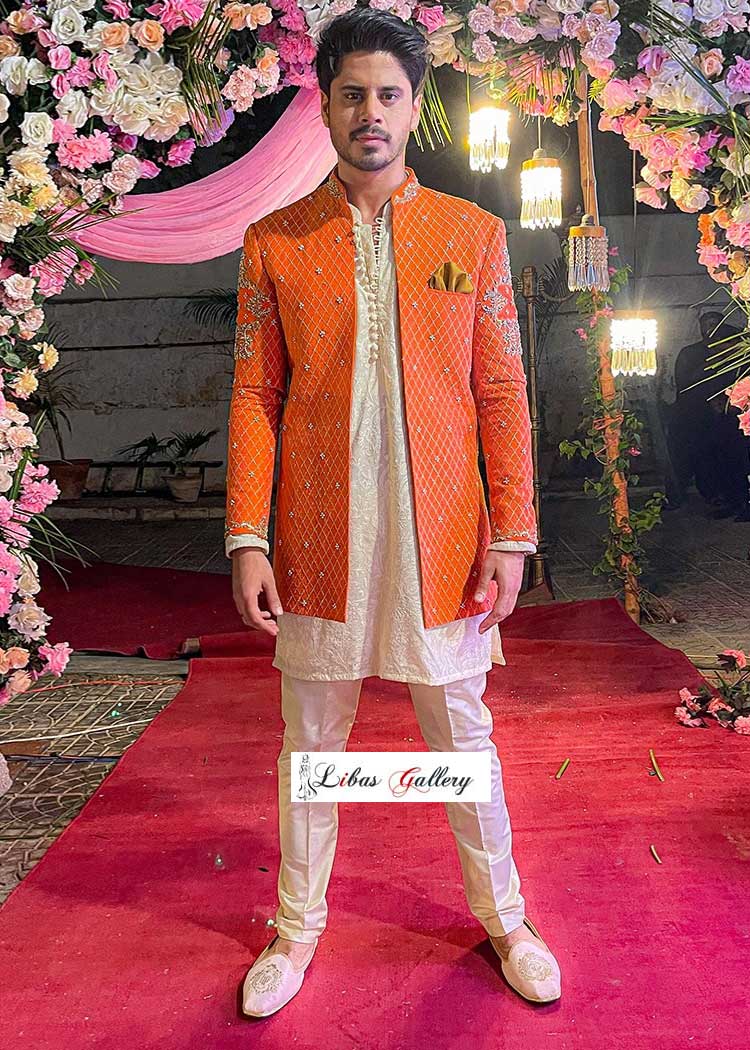 Haris Waheed Spotting in Orange Open Style Designer Sherwani Suit with Off white Inner Chikankari Loop Buttons Kurta and White Shoes UK USA Canada Australia Dubai