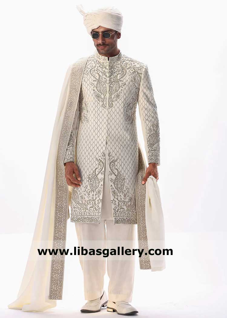 Sherwani style in cream with detailed fancified hand work paired with turban shoes and embroidered fancy groom shawl 